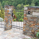 Stone fence with wrought iron